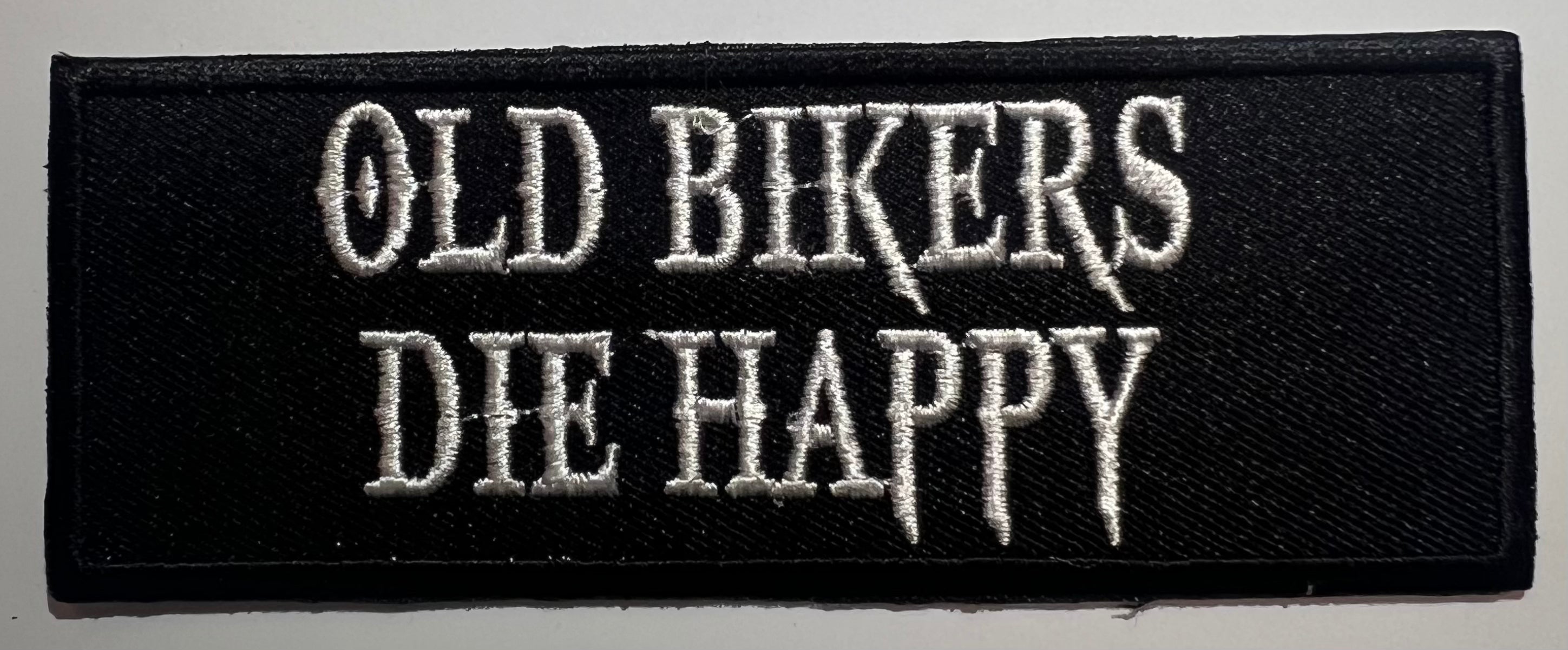 Casual motorcycle gear with Old Bikers Die Happy patch, including motocross and Harley Davidson apparel for men and women