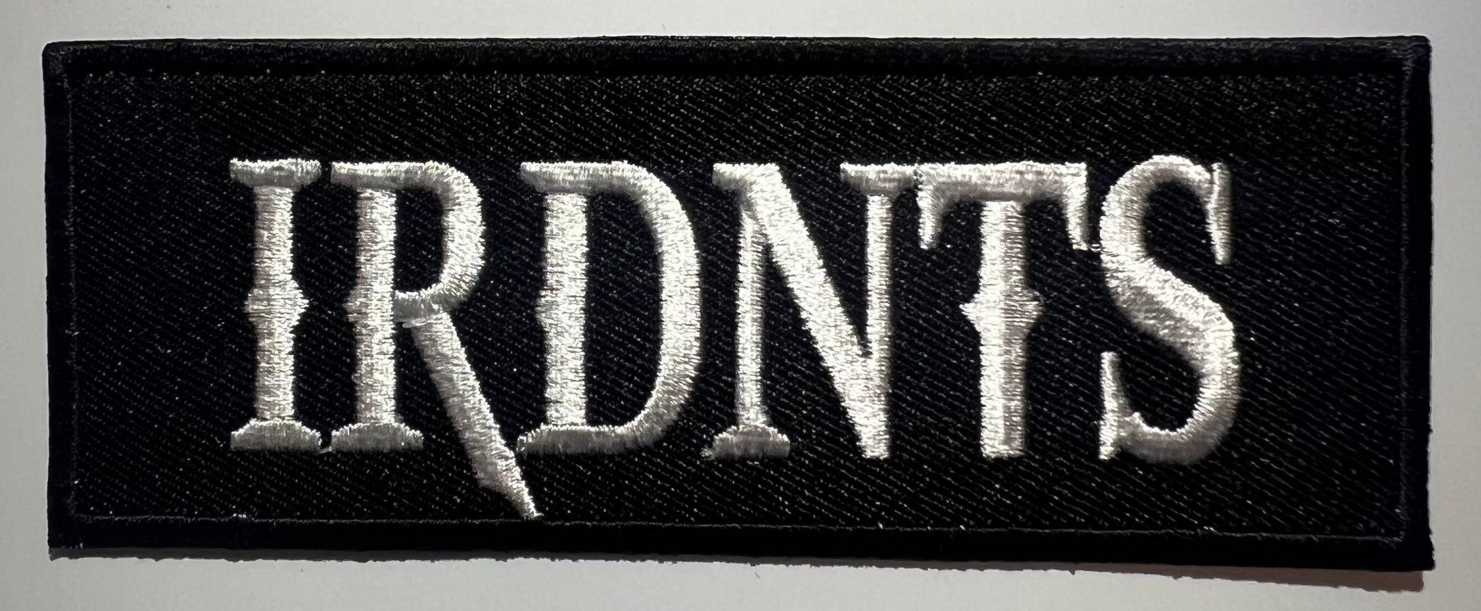 Casual motorcycle gear with IRDNTS patch, including motocross and Harley Davidson apparel for men and women