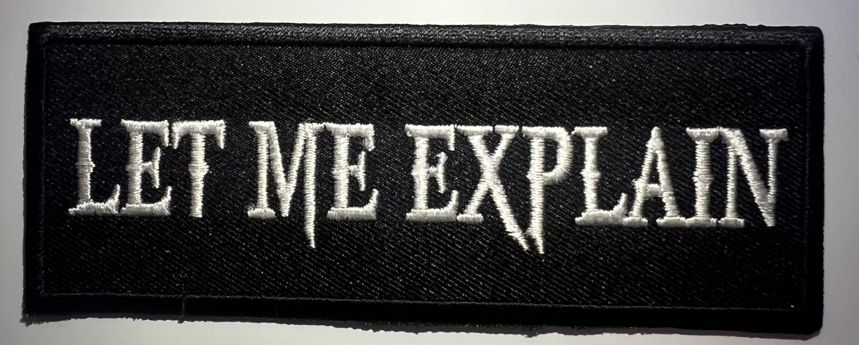 Casual motorcycle gear with 'Let Me Explain' patch, including motocross and Harley Davidson apparel for men and women